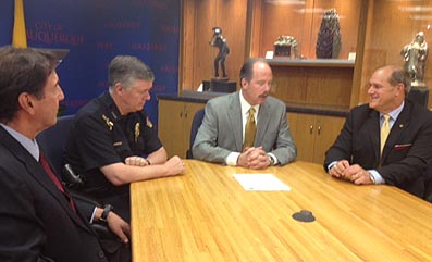(l. to r.): Bruce Perlman, APD Chief Ray Shultz, Mayor Richard Berry and UNM President Robert Frank. 