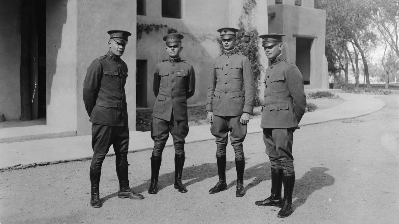 WWI soldiers in front of Hodgin Hall