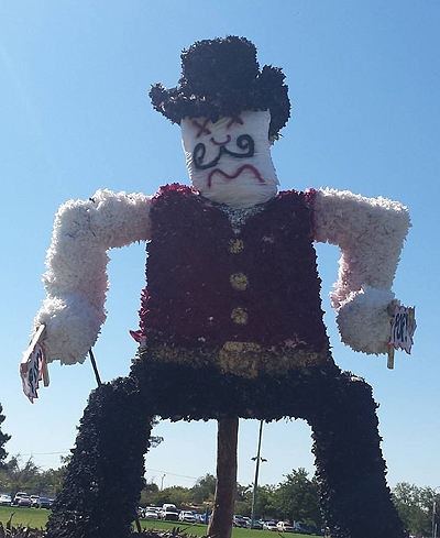 NMSU's mascot, Pistol Pete, awaits his fate from a previous UNM Red Rally bonfire. Pistol Pete