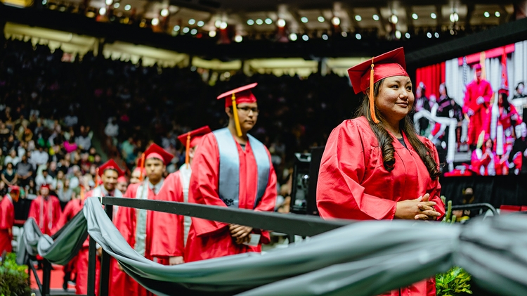 Graduates in line to receive diplomas.