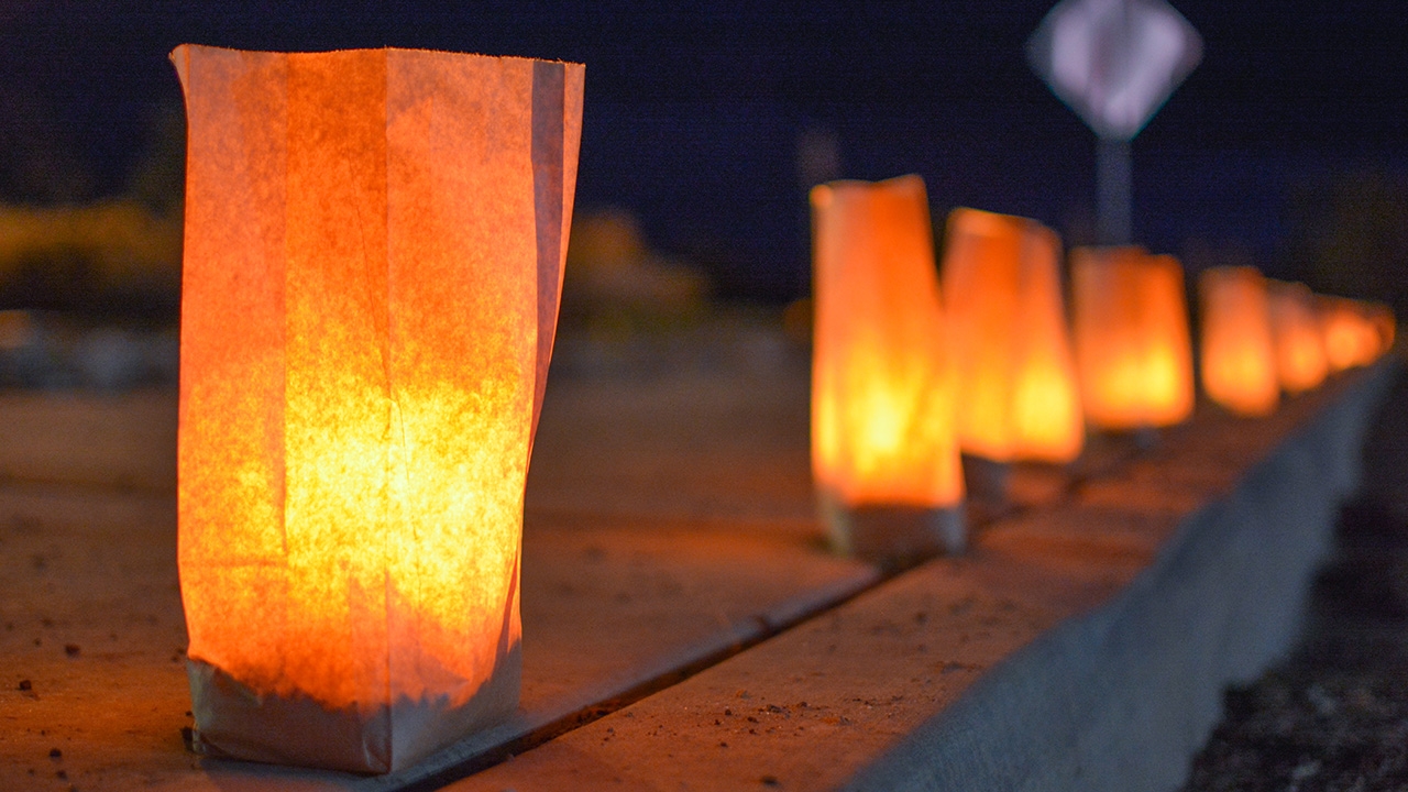 Luminarias illuminate the UNM-Gallup entrance.