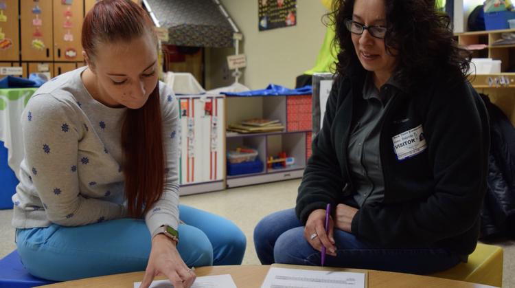 COEHS student works with families. 