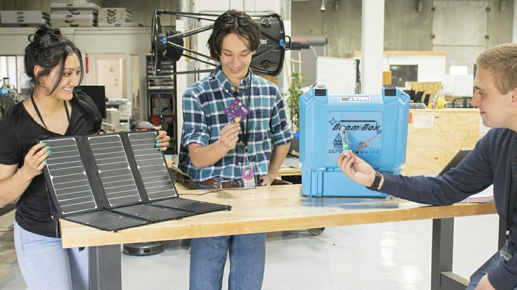 Students work on an outreach project within the broad area of space beaming.