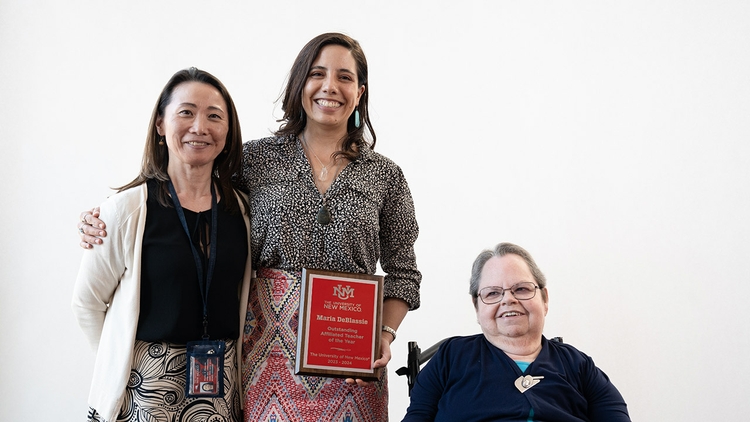 Affiliated Teacher of the Year Maria DeBlassie, center, flanked by Kiyoko Simmon (l.) and 