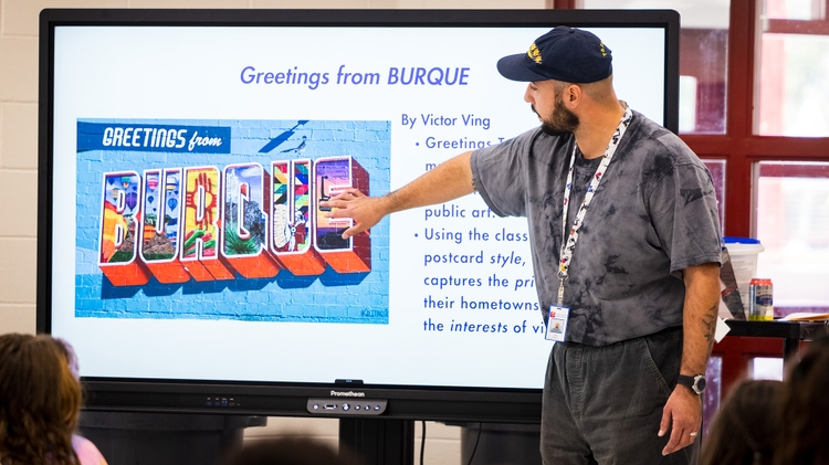 Angel Estrada explains school art project