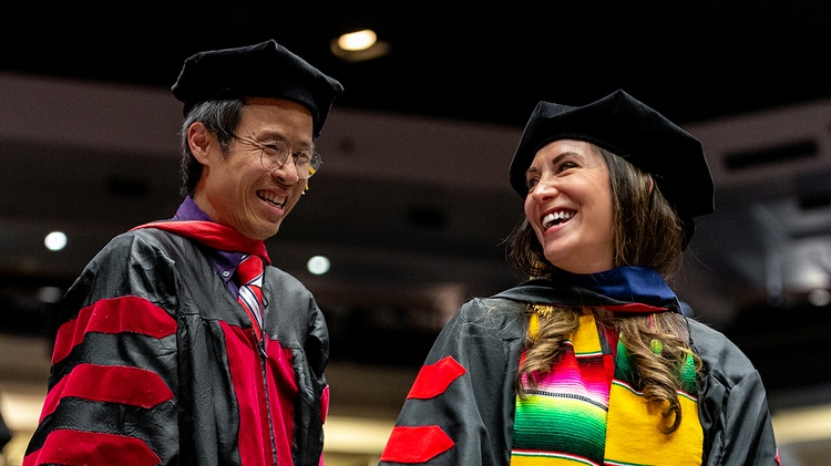 A just hooded graduate student 