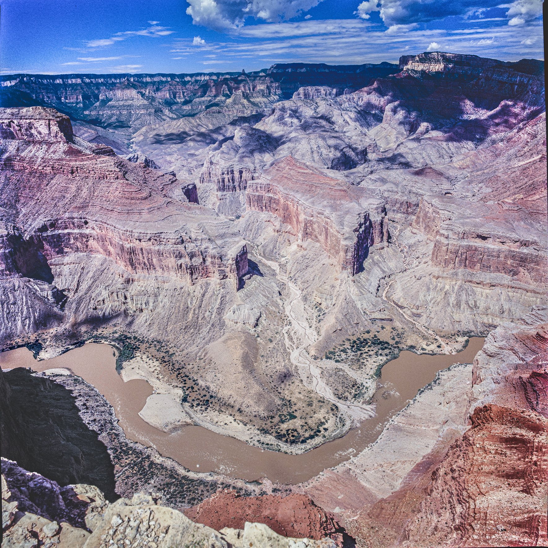 Figure 8. Looking west at Nankoweap Creek delta and remnants of the 56000-year-old landslide paleodam Colorado River flowing from right to left. Photo by Richard Hereford.