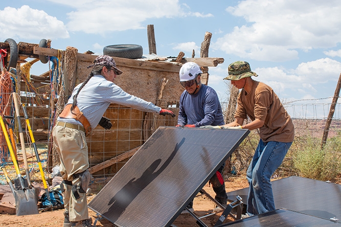 UNM-Gallup solar technician students work together.