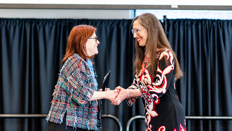 Presidential Teaching Fellow Marissa Greenberg receives congratulations 