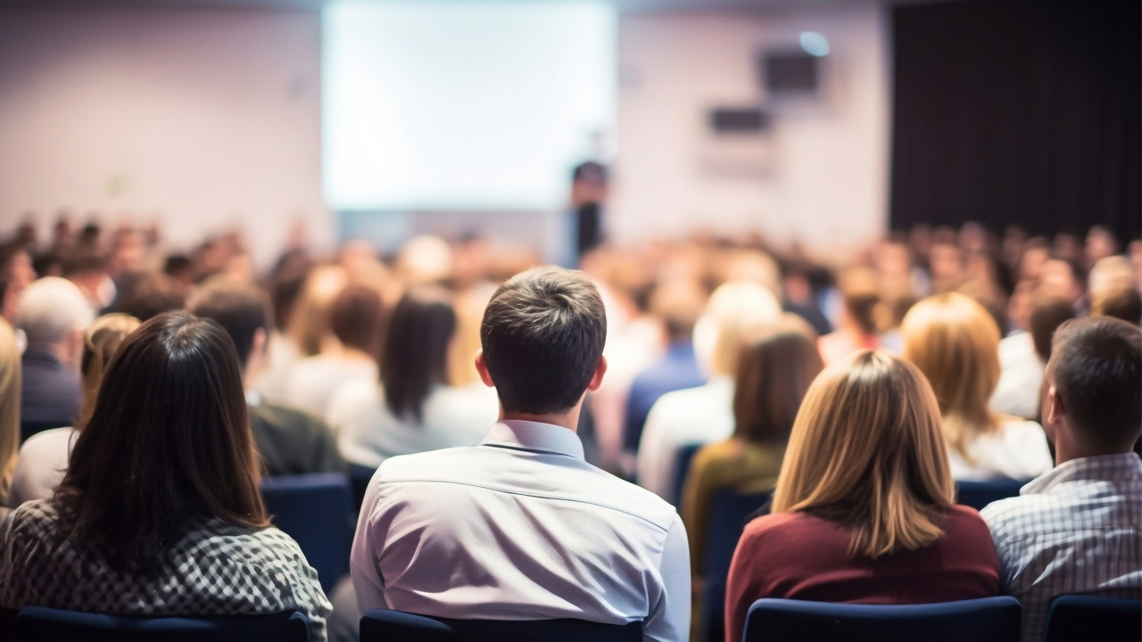 photo of a crowd at a lecture photo of a crowd at a lecture
