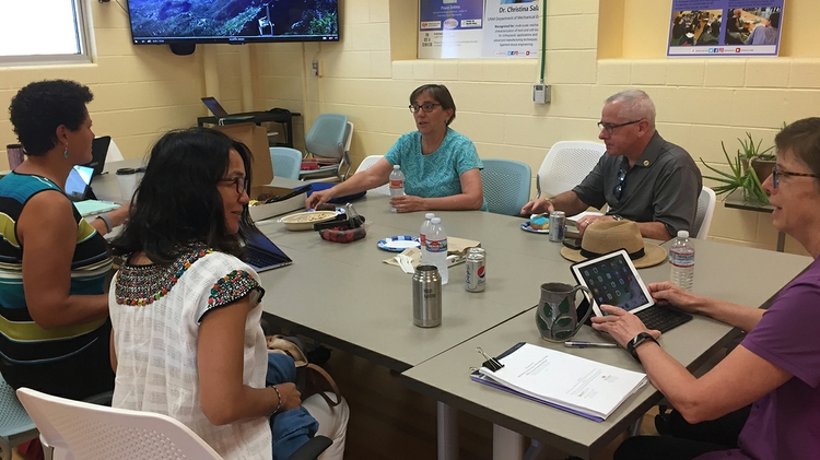 Julia Fulghum (far right) leads a meeting at ADVANCE 