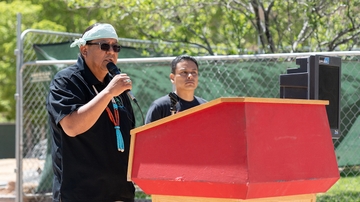 Warlance Chee (Diné), left, provides background before 
