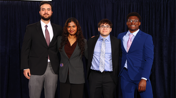 Solomon with team at student competition
