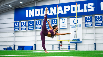 Malia Dumlao performing during the cheer fitness test in Indianapolis.
