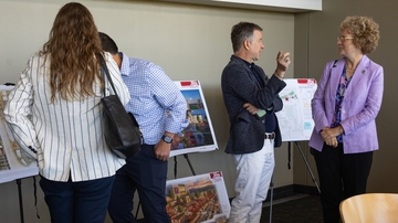 Community members discuss the 
