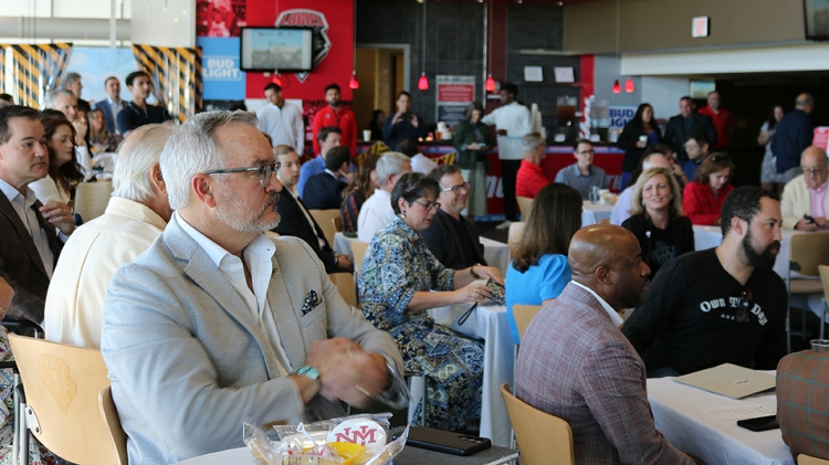 Attendees listen 