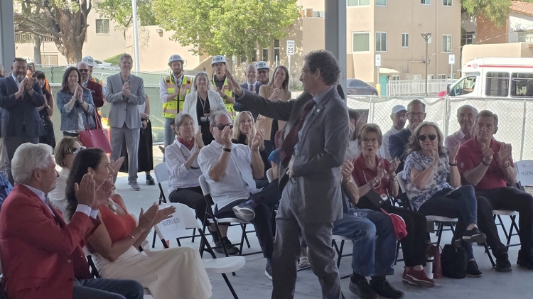 President Steve Goldstein waves to well wishers