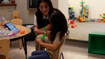Playing with a toy during the summer camp. 