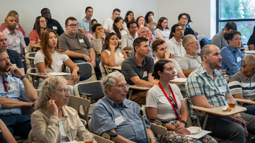 Audience members actively listening during the event.