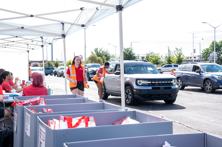 Move in Day volunteers directing traffic