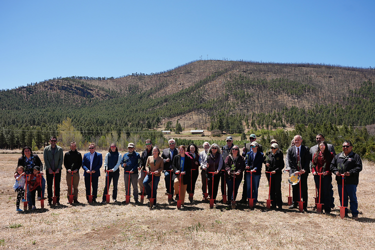 Officials with planting bars at NMRC groundbreaking