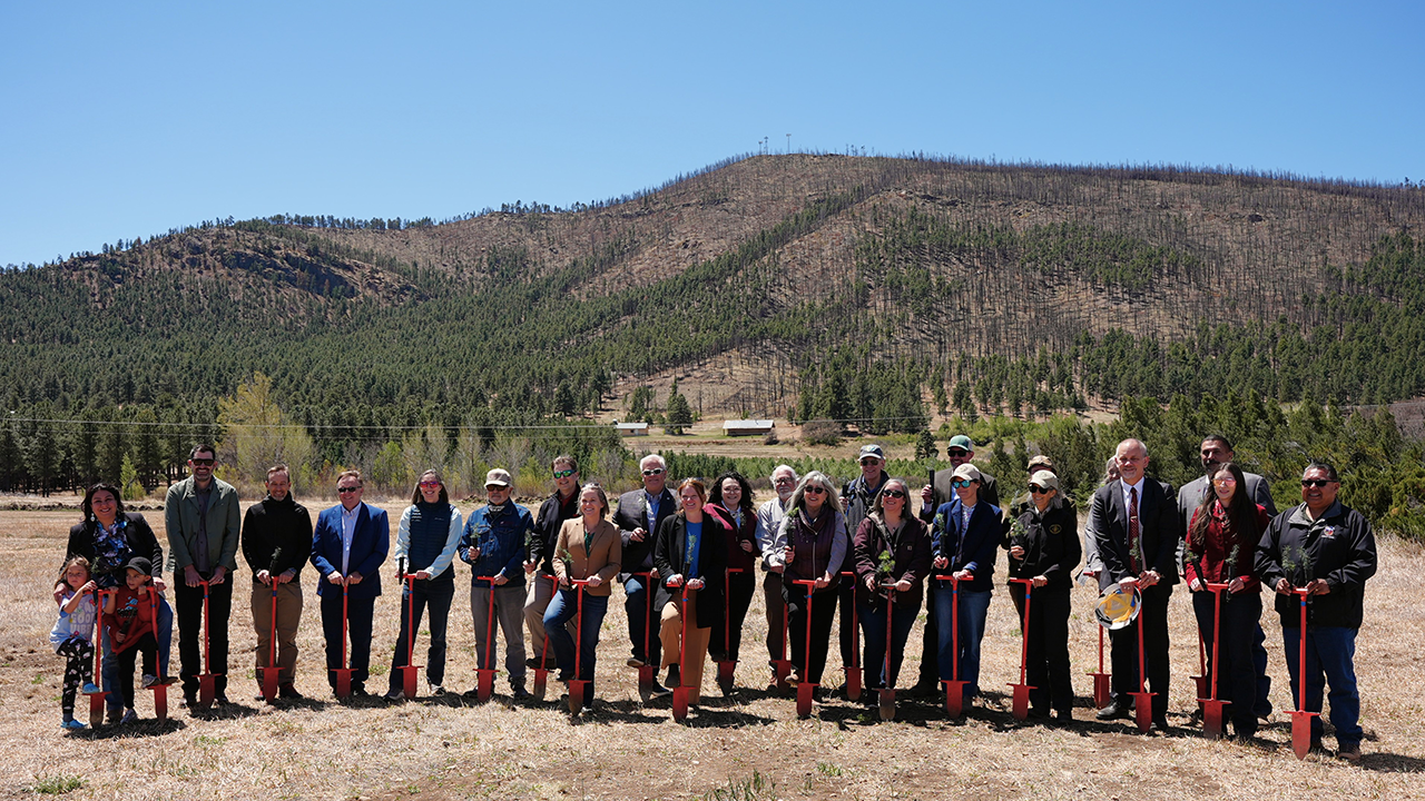 Officials with planting bars at NMRC groundbreaking