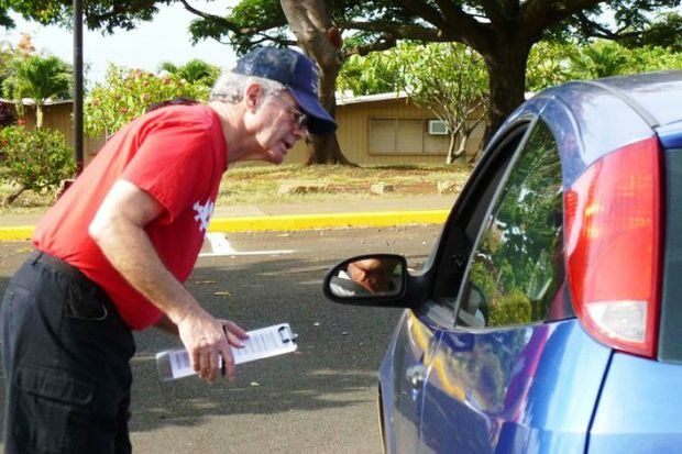 CarFit checker with clipboard and man in car