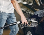 man-pours-gasoline-into-tank-of-car-5K7ZT8U