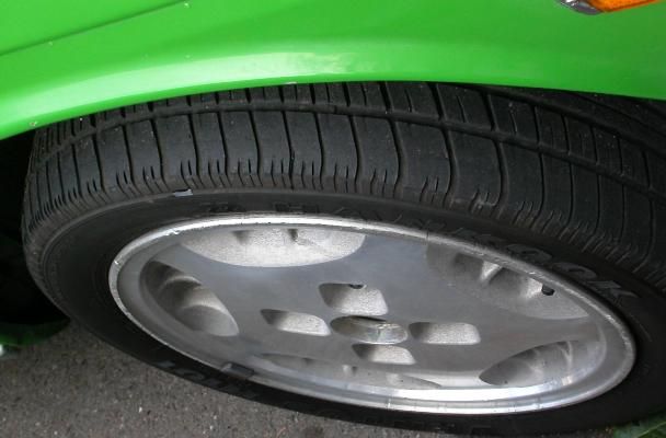 Green Car showing Tire