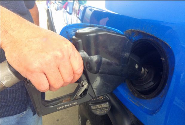 Pumping gas by Mike Mozart