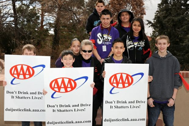 Kids hold AAA Dont Drink And Drive Signs