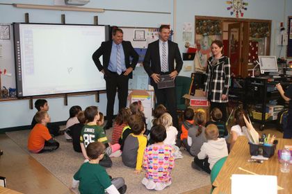Manitowoc colleagues volunteer to teach financial education to children
