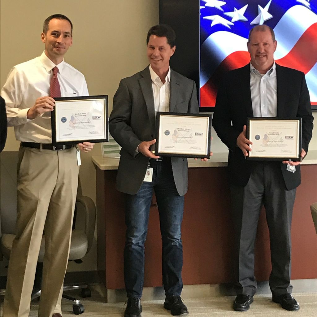 Associated Bank colleagues (from left to right), Kevin Ress, Matt Meyer and Joe Smits, in Green Bay accept a Patriot Award by the ESGR.