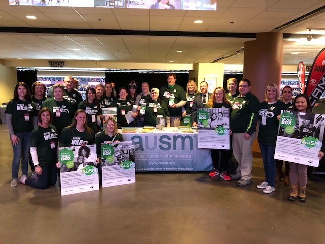 Volunteers at the Associated Bank Stock the Box event for AuSM