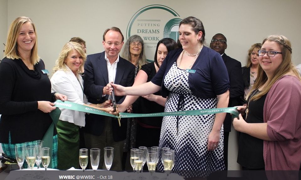 Philip B. Flynn from Associated Bank and several community partners participate in a ribbon cutting for the Wisconsin Women's Business Initiative Corporaiton's (WWBIC) new business center in the Appleton Associated Bank branch on Casaloma drive.