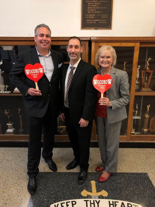 Rob Swift (left) participates in Principal for a Day at Woodrow Wilson High School in Dallas, pictured with Woodrow Wilson High School Principal Michael Moran (center) and Clare Chaney (right).