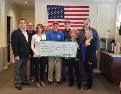 Stars and Stripes Honor Flight receives donation from Associated Bank Veterans Appreciation Event in Grafton
