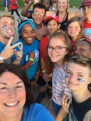 Thompson (front left) volunteering as a camp counselor at Camp Hometown Heroes
