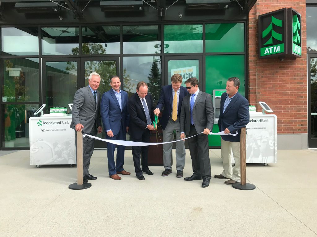 Associated Bank and the Packers celebrated the grand opening of the new Associated branch in Titletown. Pictured from left to right: David Stein, Christopher Piotrowski, Philip Flynn, Mark Murphy, Ed Policy and Craig Benzel.