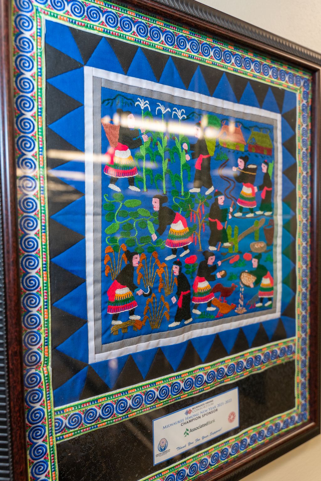 Associated Bank was recently gifted a paj-ntaub and Milwaukee Hmong Consortium's Champion Sponsor Award from the Hmong American Friendship Association (HAFA), in recognition of the bank’s partnership and support of the Hmong community. 