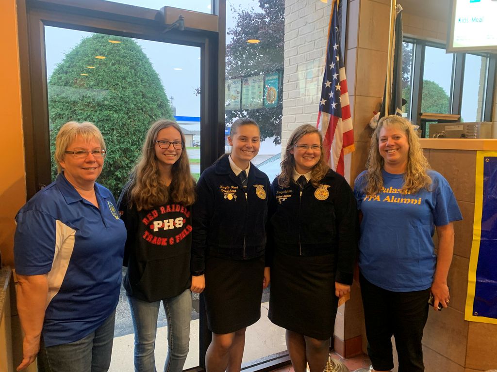 Reed (far right) pictured with daughter and other FFA members at a fundraising event.