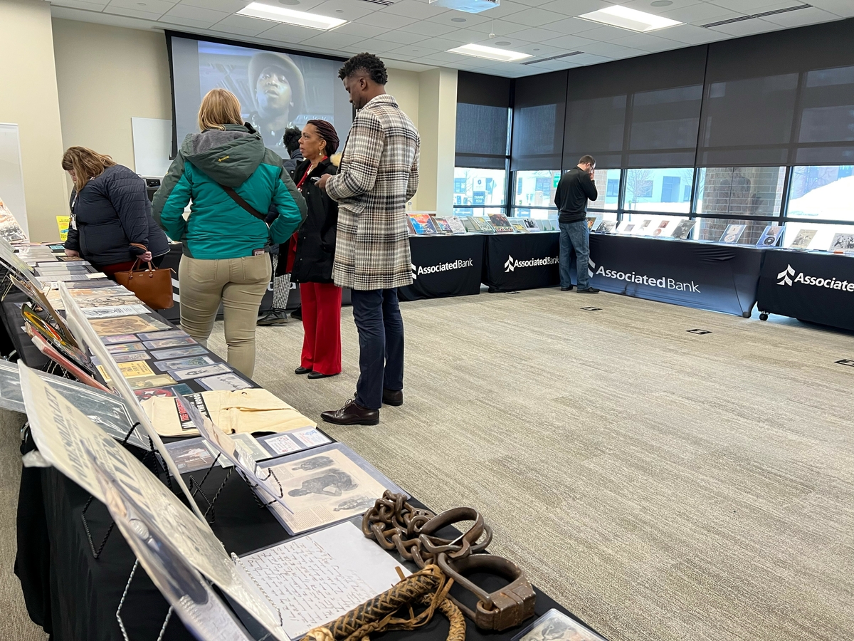 Attendees view pieces in the collection