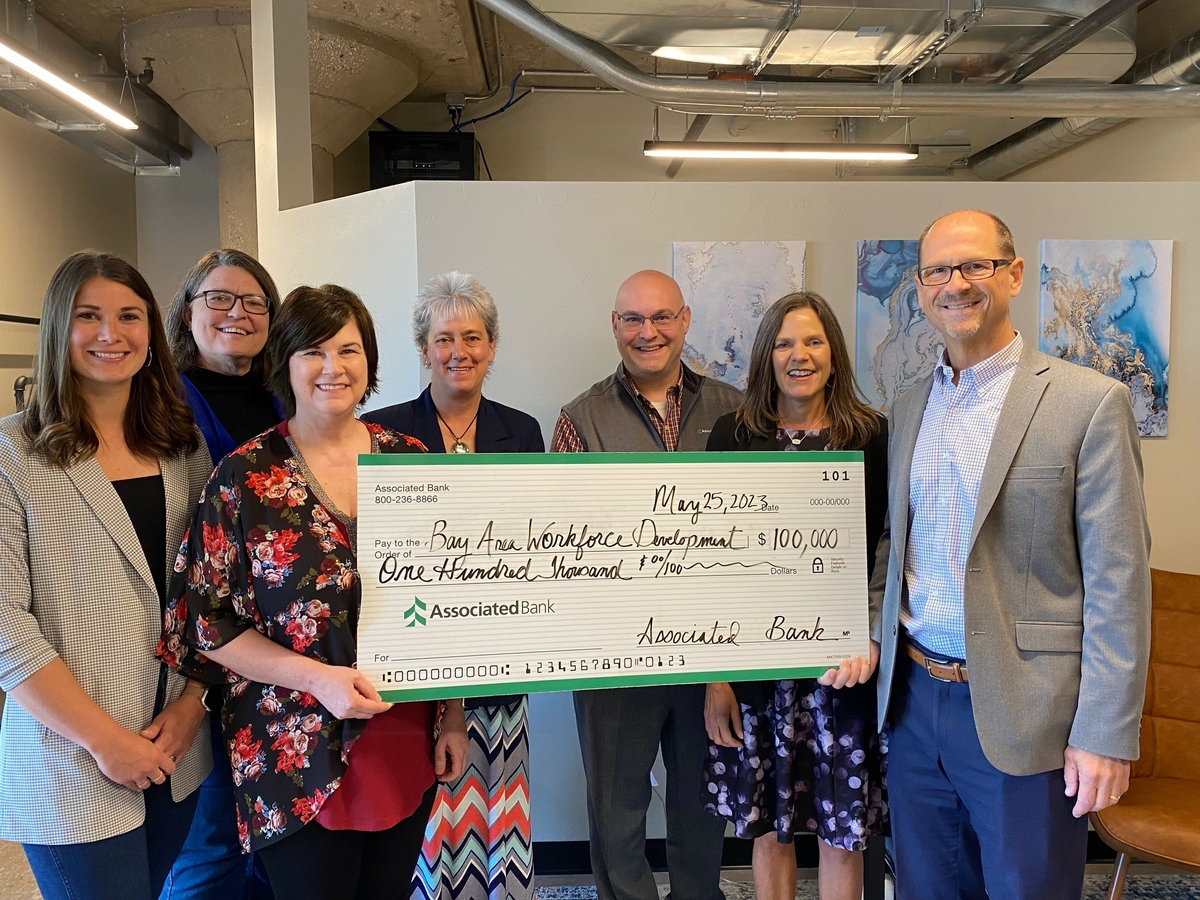 Sarah Klapper (from left), Kate Owens, Vickie Patterson and board president Cheri Galecke with Bay Area Workforce Development Board, along with Bill Kopka, Angie DeWitt and Dennis DeLoye with Associated Bank
