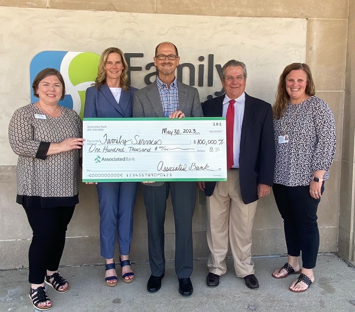 Tana Koss (from left) with Family Services, Stacy Stecker, Dennis DeLoye and Todd Bartels with Associated Bank, and Katie Rappel with Family Services