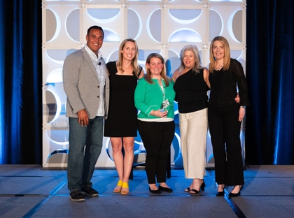Melissa Hukriede, senior vice president, director of HSA and health benefits at Associated Bank (middle), accepts WEX leadership award in recognition of her outstanding work in the health benefits division in the 2023 Community Awards at WEX Spark 2024.