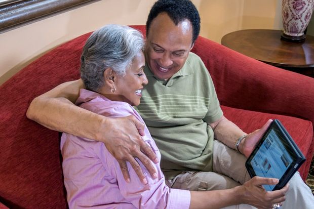 Son and mom look at AAA senior driver website