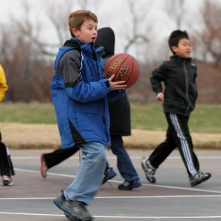Boys playing basketball outsidecopyright American Heart Association