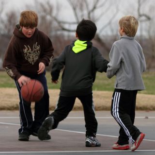 Boys playing basketball outsidecopyright American Heart Association