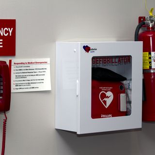 Wall mounted AED with emergency phonecopyright American Heart Association