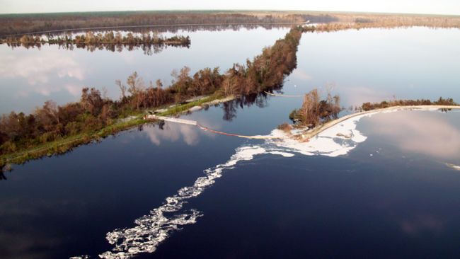 Booms at Sutton Plant discharge canal retain cenospheres in the 1971 ash basin. Photo uploaded on Sept. 22, 2018.